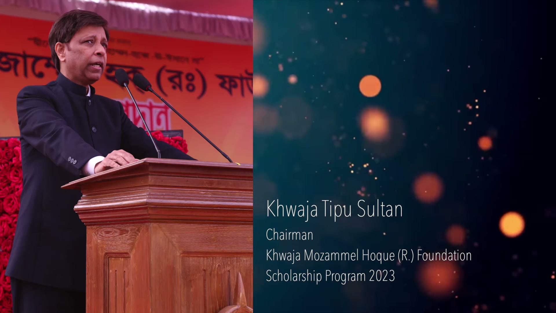 Khwaja Tipu Sultan at the lectern, beside the film’s title card for Scholarship Programme 2023.