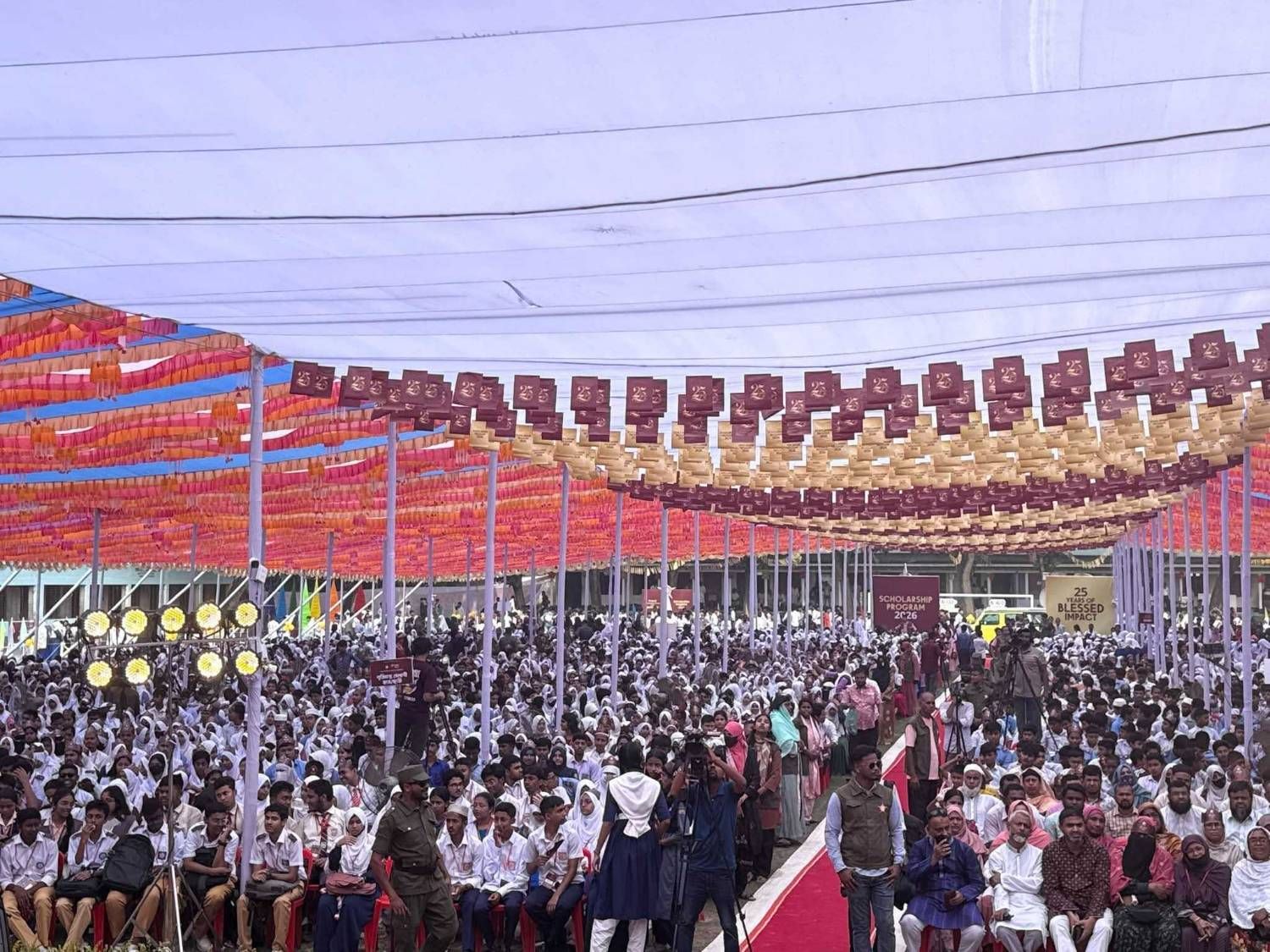 Students and their families fill the grounds at the 2026 scholarship programme.